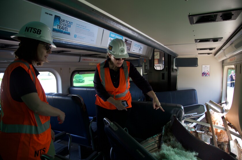 The NTSB inspects the front car of a Metra train that struck a box truck Wednesday, fatally injuring a passenger inside the train.