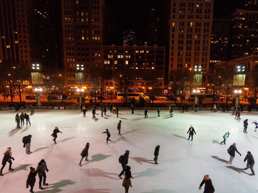 People ice skate around the McCormick rink in Millennium Park. | Tyler LaRiviere/Sun-Times