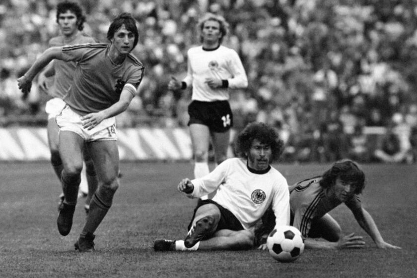 Johan Cruyff, left, runs past German defender Paul Breitner during the final of the 1974 World Cup in Munich, Germany. AP file photo