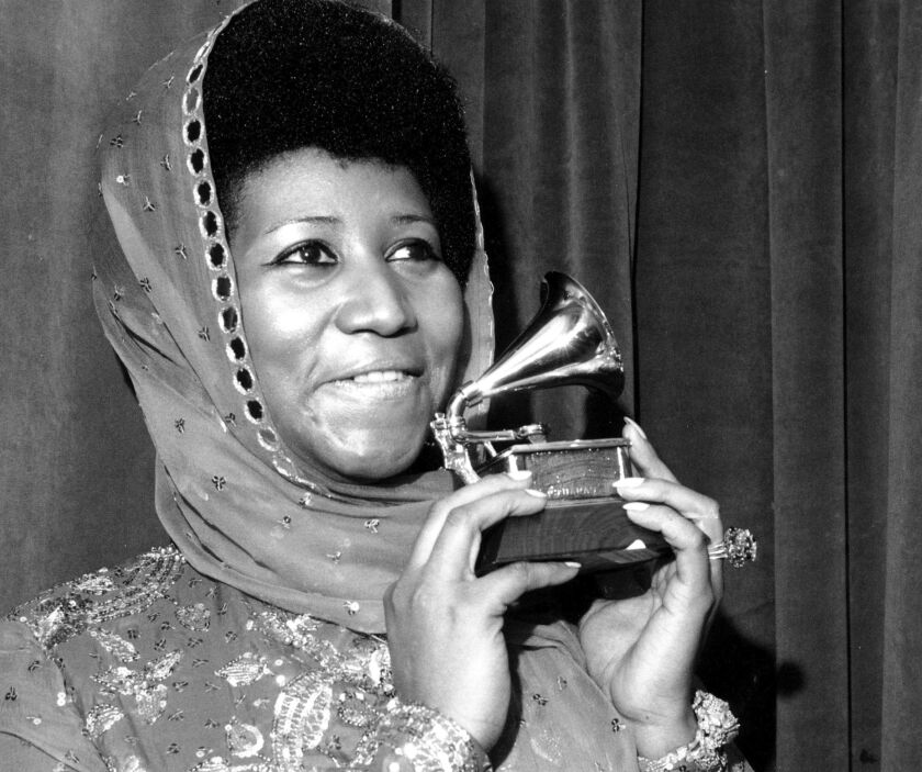 Aretha Franklin poses with her Grammy Award for best female R&B vocal performance for “Ain’t Nothing Like the Real Thing.” | AP Photo