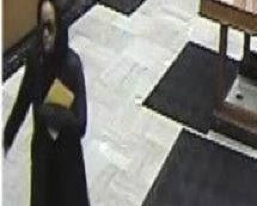 The woman who robbed the bank should be considered armed and dangerous, the FBI said. | FBI