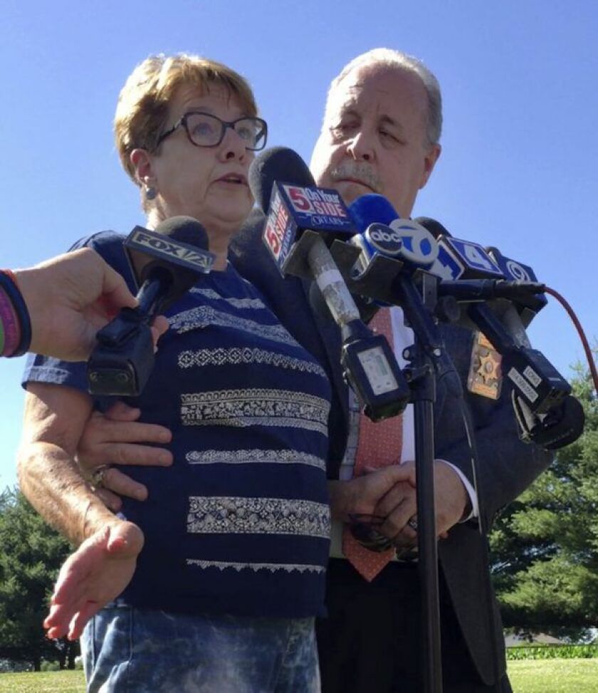 Suzanne Hodgkinson talks to reporters about her husband, James Hodgkinson. With her is St. Clair County Sheriff’s Chief Deputy Richard Wagner. | Kaley Johnson/Belleville News-Democrat, distributed by the Associated Press