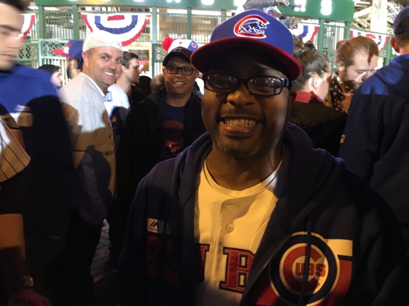 Lee Berry outside Wrigley Field celebrating the Cubs’ win that sent them to the World Series for the first time since 1945. | Jacob Wittich / Sun-Times