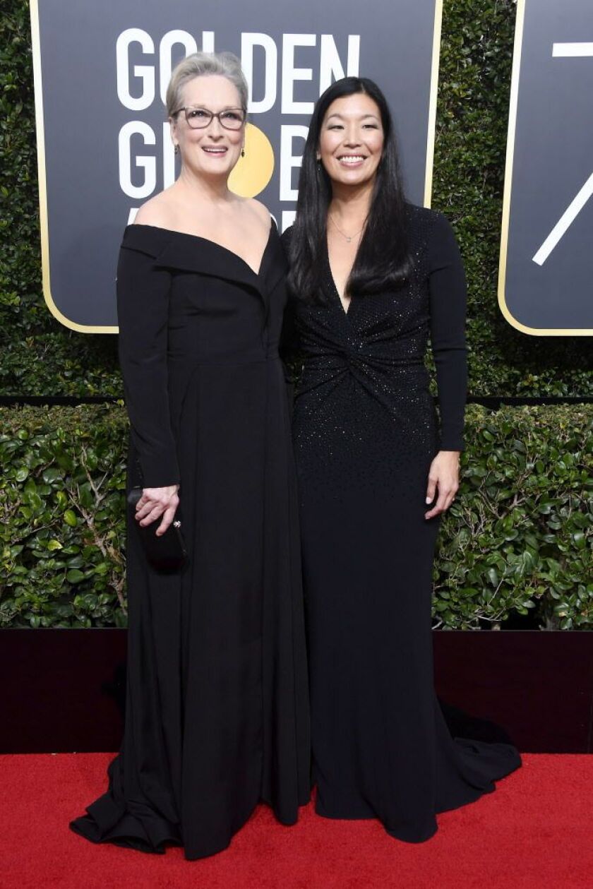 Meryl Streep and NDWA (National Domestic Workers Alliance ) director Ai-jen Poo attend The 75th Annual Golden Globe Awards at The Beverly Hilton Hotel on January 7, 2018 in Beverly Hills, California. Streep is nominated for Best Performance by an Actress