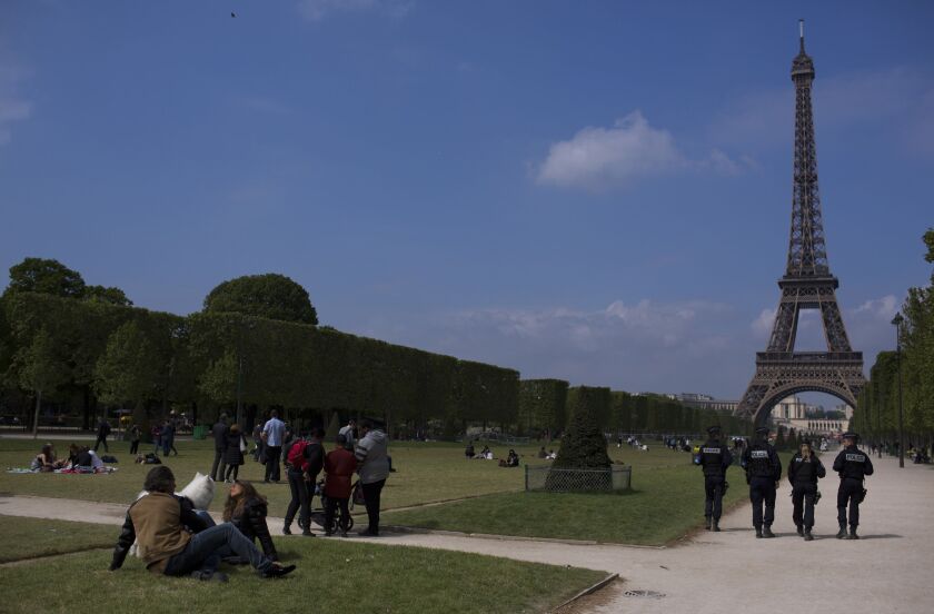French police officers patrol near the Eiffel Tower in Paris on Saturday. The outcome of France’s presidential election is being closely watched for signs that Europe is moving toward nationalist candidates who advocate the European Union’s dissolution. T