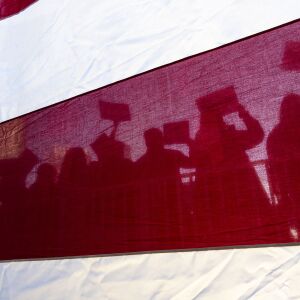 Bernie Sanders supporters cheer, while presidential candidate Bernie Sanders speaks, during his rally in Grant Park, Saturday, March 7, 2020.