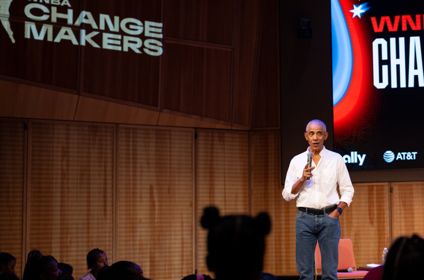 Former President Barak Obama surprises a group of high school freshman girls Friday during the WNBA Changemaker Day at the Obama Presidential Center in Jackson Park on the South Side.