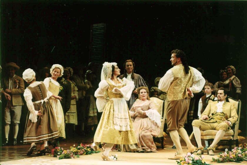 The wedding dance scene in Sir Peter Hall’s production of “The Marriage of Figaro” at Lyric Opera of Chicago during the 2003-2004 season. (Photo: Dan Rest/ Lyric Opera of Chicago.)