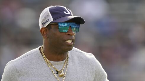 Jackson State head coach Deion Sanders surveys his players during warmups prior to the Southwestern Athletic Conference championship game.