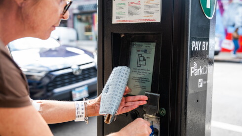 A driver pays for parking on ParkChicago’s parking meter on North Clark Street in Andersonville, Tuesday, Sept. 15, 2026.