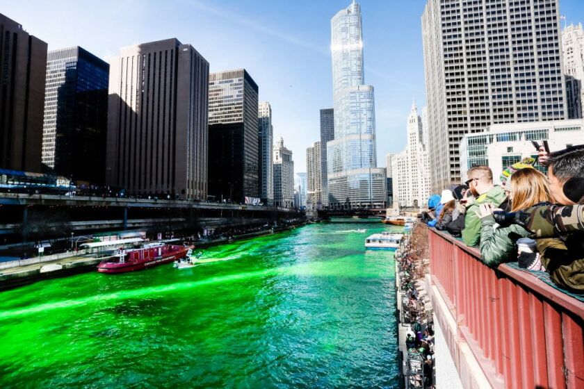 Members of the Chicago Journeymen Plumbers union use an environmentally friendly dye to turn the Chicago River emerald green. | James Foster/For the Sun-Times