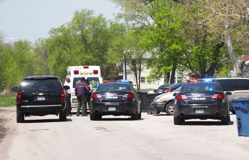 Police investigate a shooting Thursday, May 10, 2018 in the 14500 block of Ashland Avenue in Harvey. | Justin Jackson/ Sun-Times