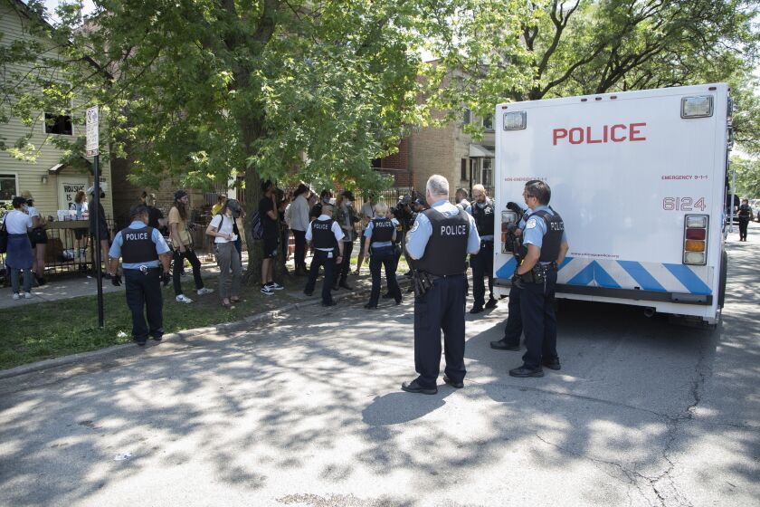 Chicago police break up a protest at 1629 N. Washtenaw Ave in Humboldt Park on Friday, Aug. 5, 2022.