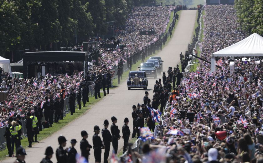 The motorcade with Meghan Markle arrives for the wedding ceremony of Prince Harry and Meghan Markle at St. George’s Chapel in Windsor Castle in Windsor, near London, England, Saturday, May 19, 2018. (AP Photo/Emilio Morenatti)