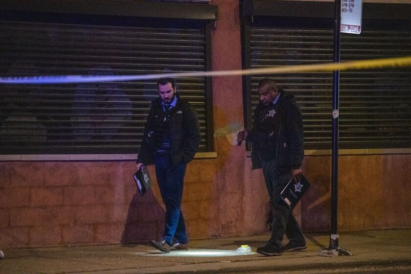 Chicago Police investigate the scene where a man was shot in the head, Saturday morning, in the 200 block of North Kedzie, in the Garfield Park neighborhood. | Tyler LaRiviere/Sun-Times
