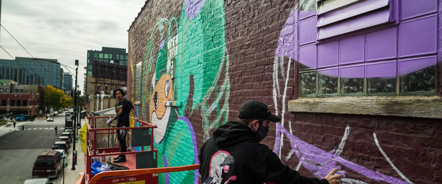 At left, Reddor Santiago works on his character “Kid Red” wearing a “mecha-suit.” At right, Blake Jones fills in the outline of his purple rabbit.