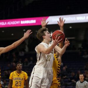 St. Ignatius’s Derek Dingens (22) scores against Loyola’s Quinn Pemberton (11) in their 56-46 loss at Northwestern University in Evanston, Friday, February 8, 2019. | Kevin Tanaka/For the Sun Times