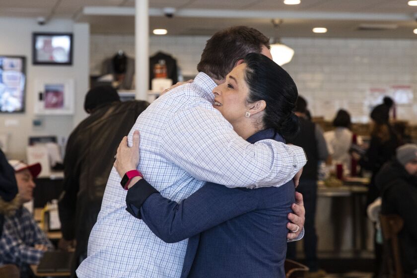 Illinois Comptroller Susana Mendoza hugs Dan Raskin