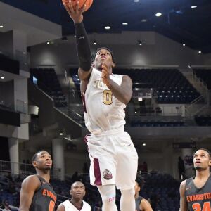 Uplift’s Markese Jacobs (0) gets a finger roll. Worsom Robinson/For the Sun-Times.