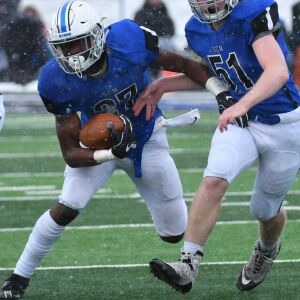 Tyler Nubin (27) of St. Charles North side steps Mount Carmel’s defense. Worsom Robinson/For the Sun-Times.