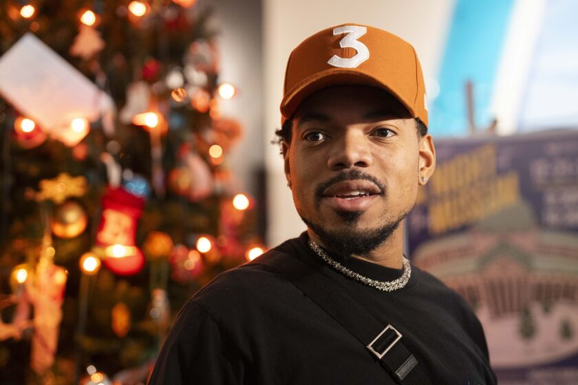 Chance the Rapper speaks to the press after a tree lighting ceremony at the Museum of Science and Industry, Saturday, Nov. 18, 2023.