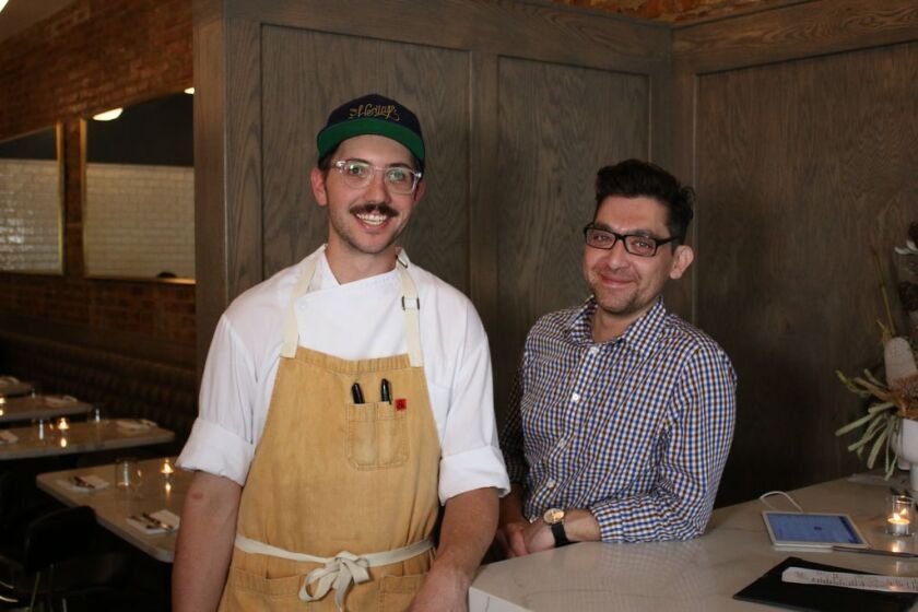 Chef Rick Ohlemacher (left) and GM Salvador Lozano-Alvarado of The Heritage restaurant in Forest Park. 