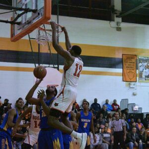 Bogan’s Rashuan Agee (12) gets a tip dunk. Worsom Robinson/For the Sun-Times.