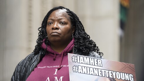 Anjanette Young, a social worker whose home was wrongfully raided by Chicago police officers in 2021, wears a jacket that reads, “I am her” during a press conference outside City Hall in the Loop, Friday, Feb. 16, 2024.