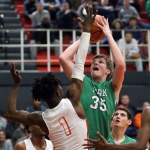 York’s Sam Walsh (35) scores over Whitney Young’s Sangolay Njie (1) in their 58-56 loss in Hillside, Wednesday, March 6, 2019. | Kevin Tanaka/For the Sun Times