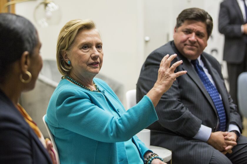 Former U.S. Secretary of State Hillary Clinton, center, then gubernatorial candidate J.B. Pritzker and his running mate Juliana Stratton participate in a roundtable discussion in 2018.