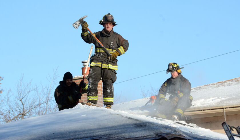 Firefighters put out a house fire Wednesday afternoon in the South Side Calumet Heights neighborhood. | Brian Jackson/ Sun-Times