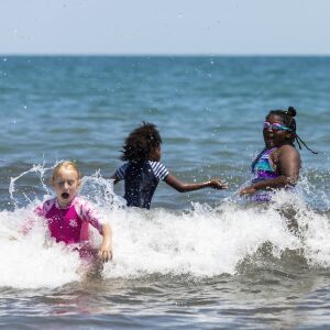 Kids, between the ages of 6 and 12, enrolled in the Chicago Park District summer camp at Nichols Park play in Lake Michigan at 57th Street Beach near Promontory Point on the South Side, Wednesday afternoon, July 24, 2019.