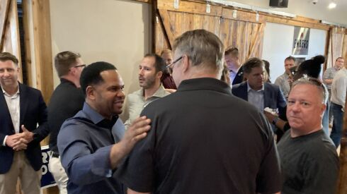 Aurora Mayor Richard Irvin meets with supporters in Lockport last week.