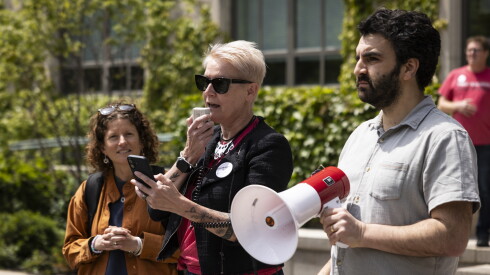 Jessica Darrow speaks into a megaphone.