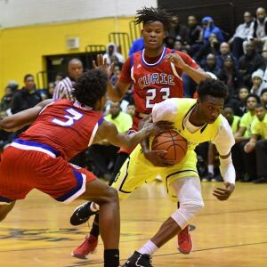 Curie’s DaJuan Gordon (3) reaches in for the ball. Worsom Robinson/For the Sun-Times.