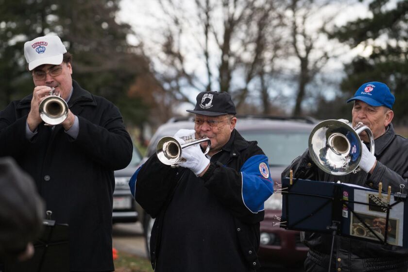Alumni of the Royal Airs perform at a memorial at Queen of Heaven Cemetery on Dec. 2, 2018, to remember the 92 students and three sisters killed in December 1958 during a fire at Our Lady of the Angels School.