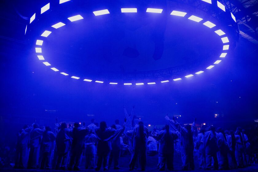 Kanye West and the Sunday Service Choir perform at the Credit Union 1 Arena during the NBA All-Star Weekend, Sunday afternoon, Feb. 16, 2020.