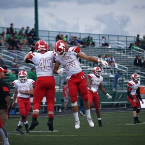 Marist’s Jake Duerr (40) and Colin Bohanek (44) get fired up before the game. Worsom Robinson/For the Sun-Times.