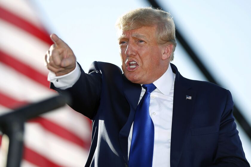 Former President Donald Trump speaks at a rally at the Delaware County Fairgrounds, April 23, 2022, in Delaware, Ohio. Former President Donald Trump has paid the $110,000 in fines on Thursday, May 19, 2022, that he racked up after being held in contempt of court for being slow to respond to a civil subpoena issued by New York's attorney general Letitia James.