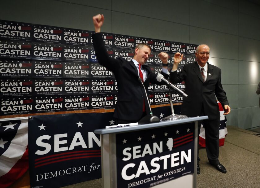 Democrat Sean Casten, left, celebrates with U.S. Rep Bill Foster during an election night party at the IBEW Hall in Warrenville in 2018.