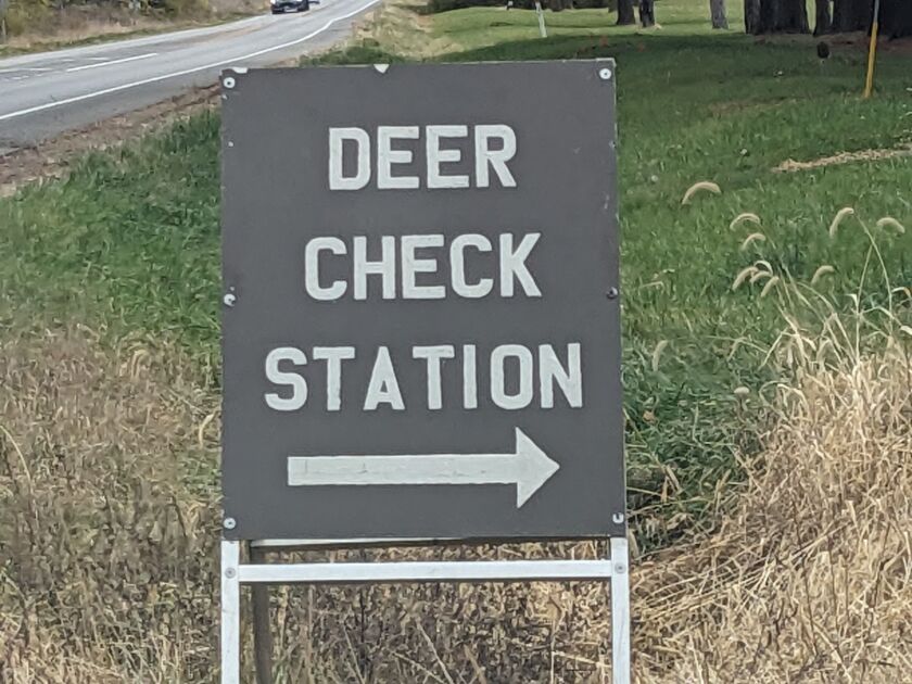 A sign for a deer-check station on opening day of the first part of firearm deer season on Nov. 17.