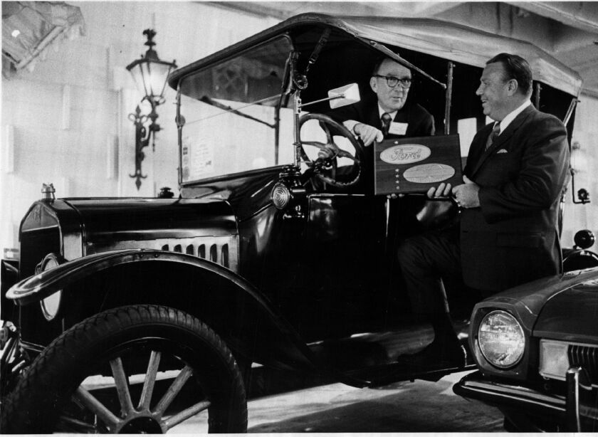 Fred G. Litsinger Fred G. Litsinger, at the wheel of a 1921 Model T Ford, accepts an award for completing 50 years as a Ford Motor Co. dealer in Chicago from B. L. Crumpton, Ford division Chicago district sales manager.