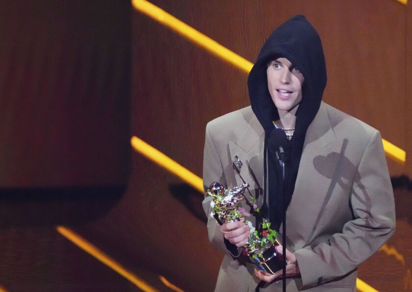 Justin Bieber accepts the award for artist of the year at the MTV Video Music Awards at Barclays Center on Sunday night in New York. 