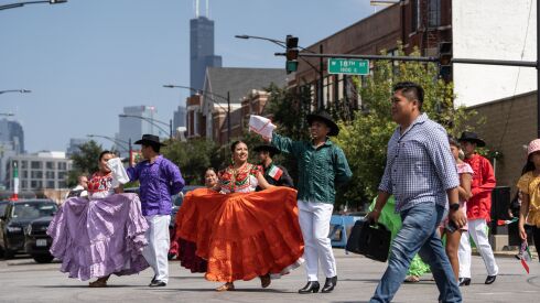 Dancers peform with the Willis Tower in the background during the 20th annual Mexican Independence Day Parade along West 18th Street in the Pilsen neighborhood, Saturday afternoon, Sept. 10, 2022.