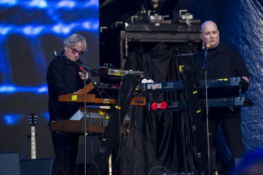 DEVO performs at the Riot Stage on day 4 of Riot Fest.