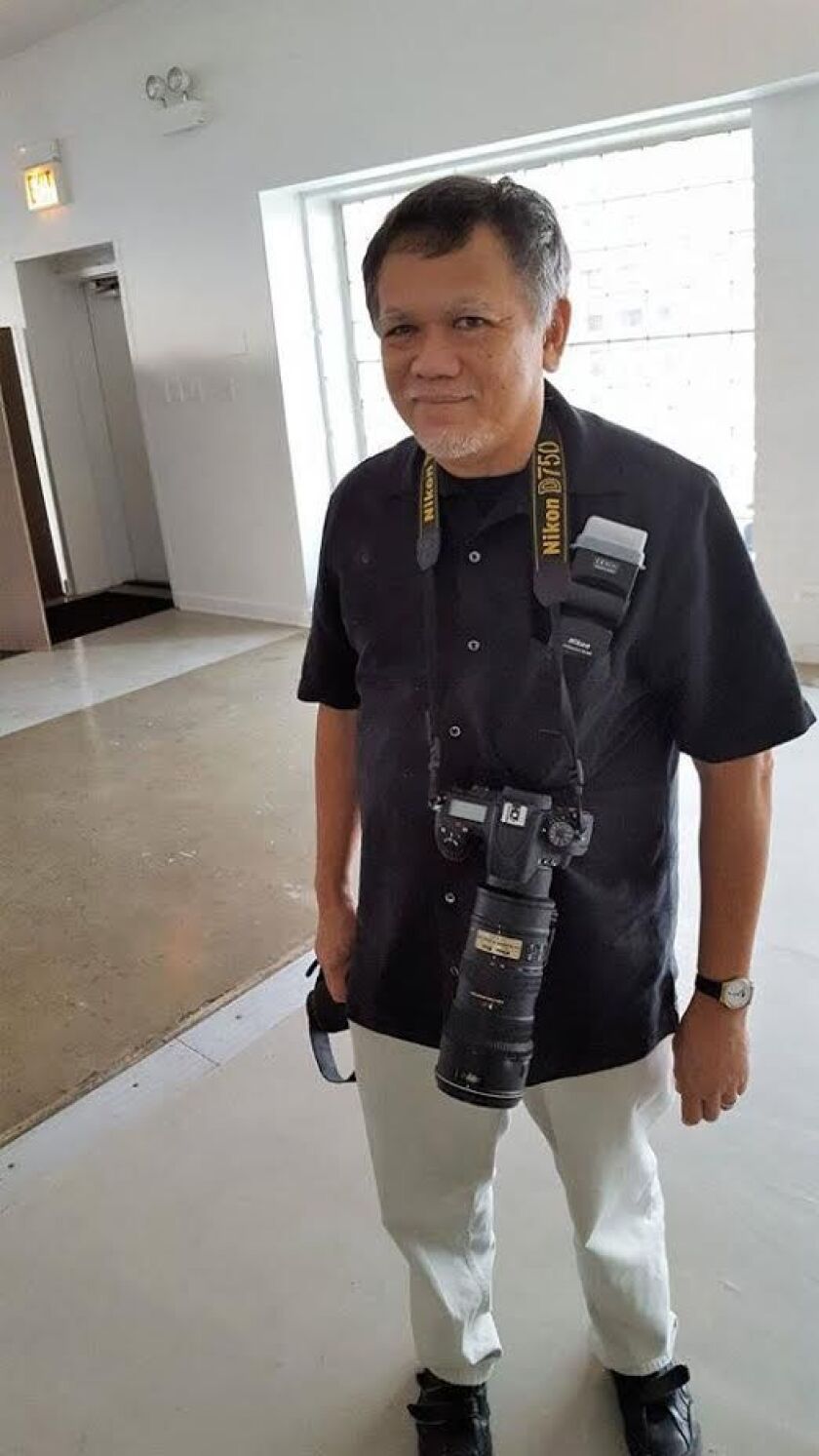 Ken Ilio was a gifted photographer. He’s preparing here to take photos at the wedding of friends.