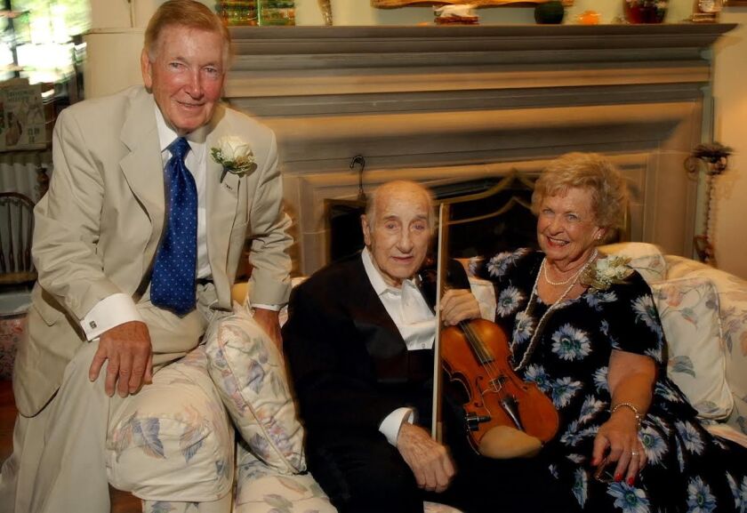 Jazz violinist Johnny Frigo, 88, middle, photographed with Patricia and Robert C. Buckley at the couple’s 50th wedding anniversary gathering. Frigo performed at their wedding reception on Sept. 24, 1955. | Sun-Times files