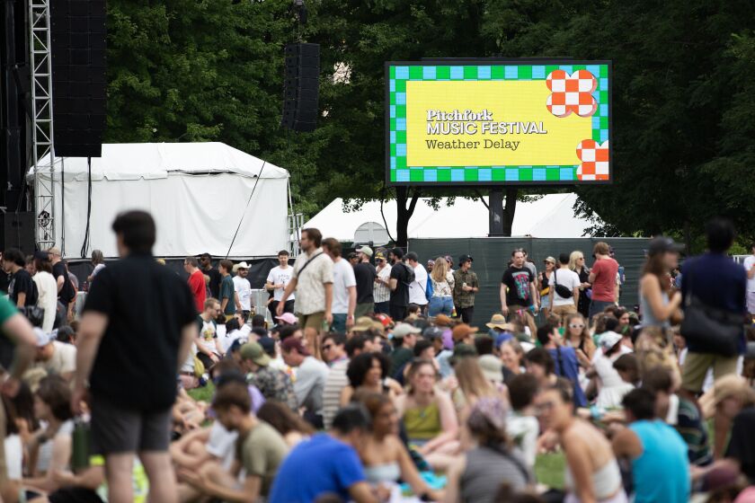 A screen displays a weather delay message at the Green Stage at Pitchfork on Saturday afternoon.