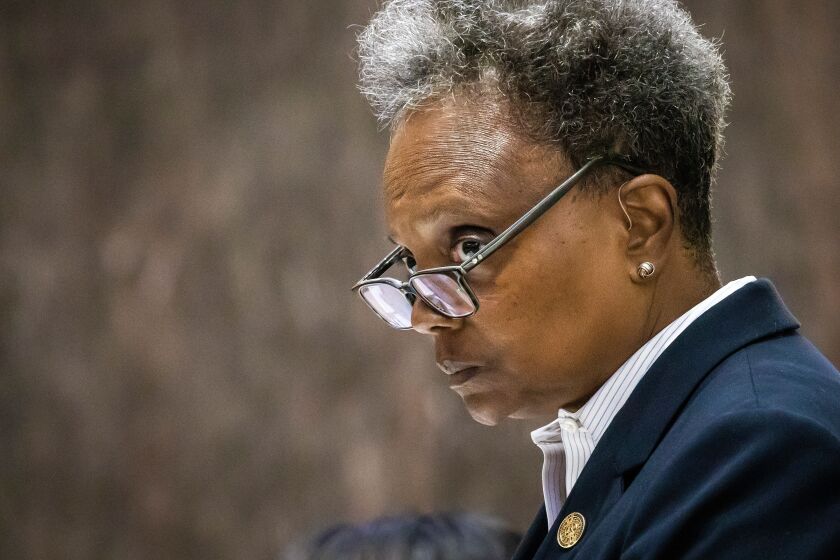 Mayor Lori Lightfoot, who won her fight to keep a lower ticket threshold for ticketing drivers caught by speed cameras, presides over a Chicago City Council meeting at City Hall, Wednesday, July 20.