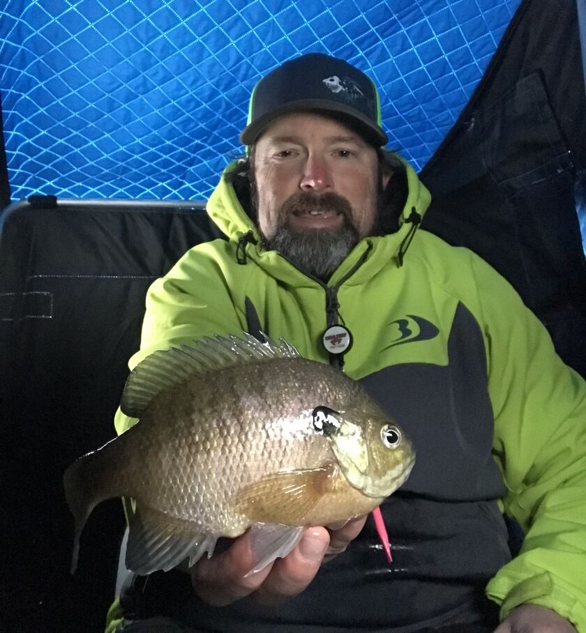 Ken “Husker” O’Malley with a bluegill on local ice. Provided photo